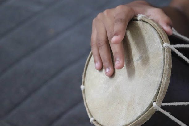 istock Fingers Playing Indian Musical Instrument Dholak Dhol 1194530931