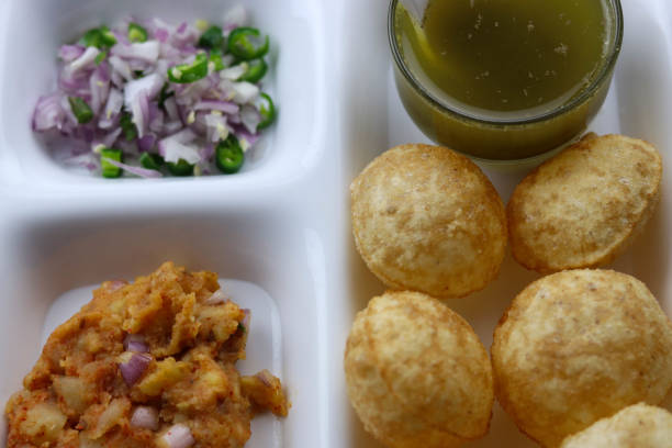 istock Selective Focus Indian Popular Famous Snacks Pani Puri Poori Phuchka Golgappe Full Screen 1194531101