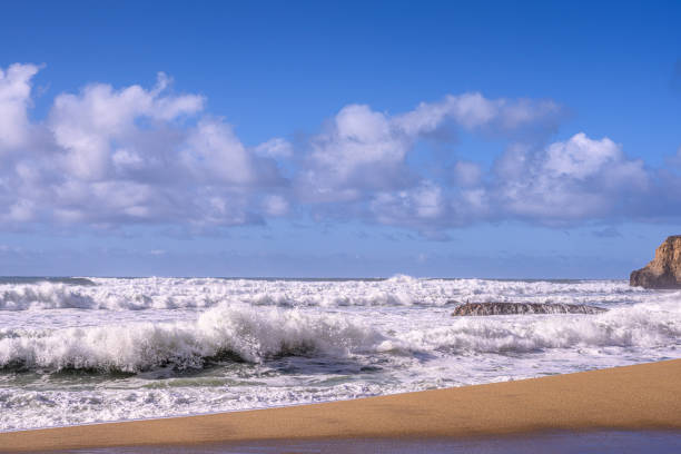 istock Turbulent Ocean Waves On Beach Off California Coast 1194532461