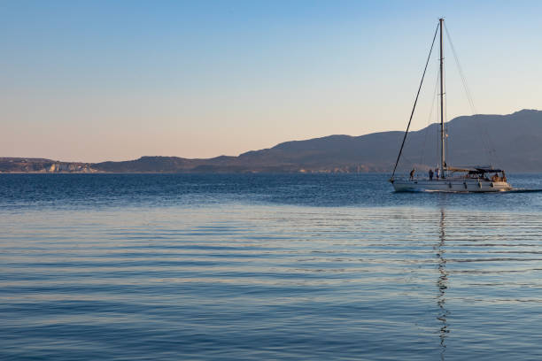 istock Sail boat navigating in a bay in Milos 1194532542