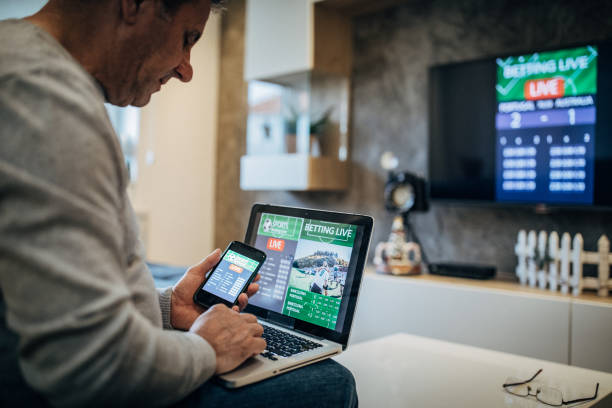 istock Senior man watches soccer game and bets 1194534085