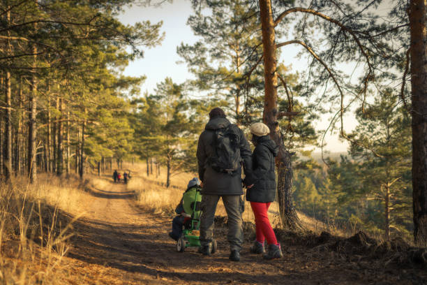 istock family walking in forest 1194534360