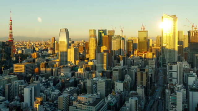 Time Lapse of the densely packs buildings of Tokyo Japan at sunrise