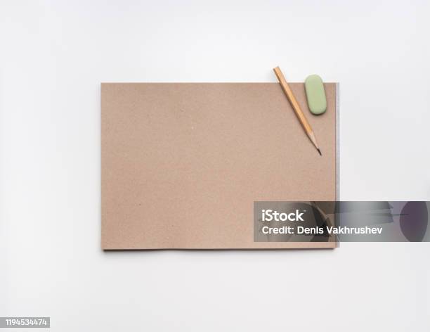 Open Craft Paper Sketchbook With Pencils And Eraser On White Background  Stock Photo - Download Image Now - iStock
