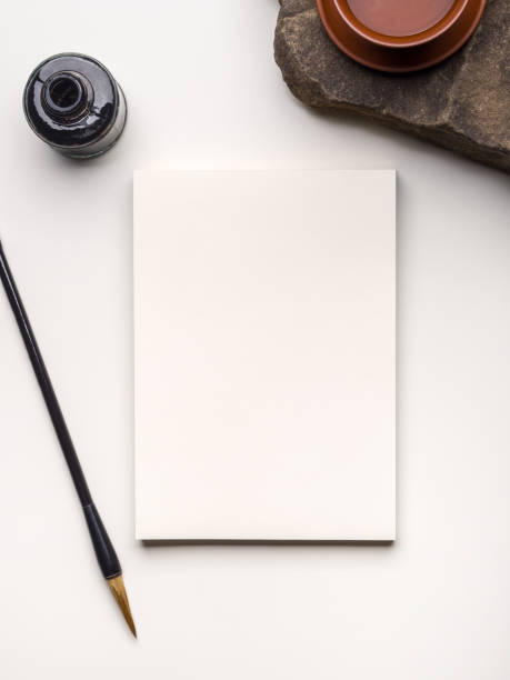 istock Still life with open notebook, traditional Chinese calligraphy tools and cup of green tea 1194535106