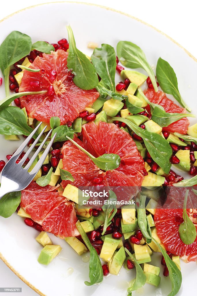 Fresh salad with grapefruit, avocado and pomegranate seeds  Avocado Stock Photo