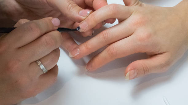 istock Professional manicure process in beauty salon 1194537763