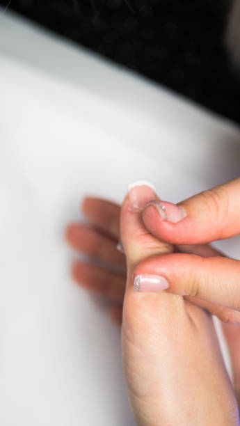 istock Manicure. Master make nail extension. hands closeup 1194537779