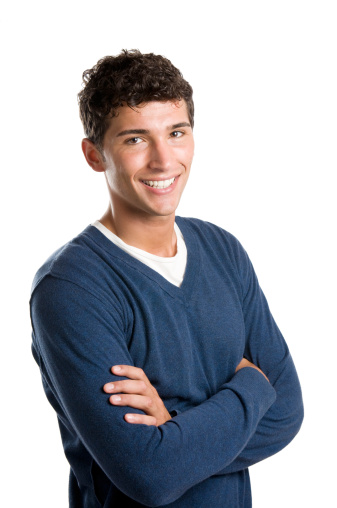 Young smiling latin man looking at camera isolated on white background.