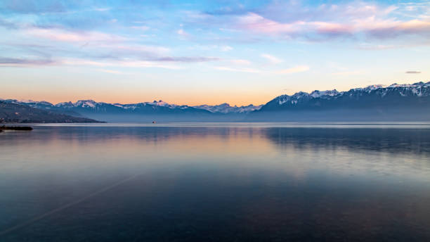 istock Sunset over Alps mountains and Lake Geneva 1194539192