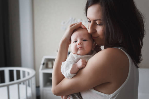 istock A young mother with her newborn baby. 1194539248