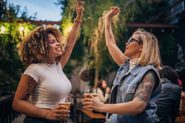 istock Multi-ethnic group of friends dancing in pub. 1194540227