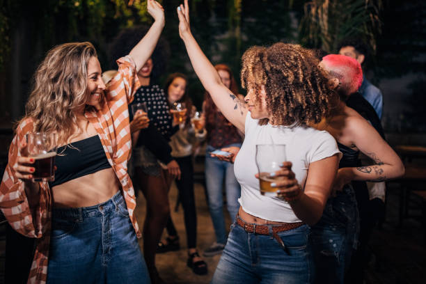istock Multi-ethnic group of friends dancing in pub. 1194540263