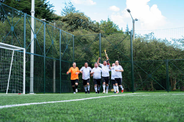 Men performing a warm-up before playing the football game