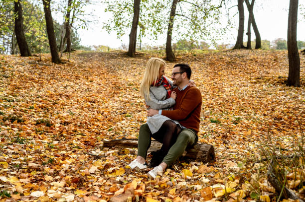 istock Romantic couple in autumn park 1194544802