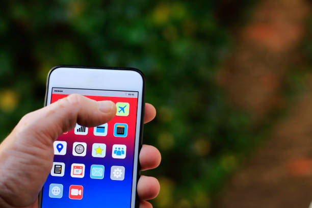 istock Focusing Commercial Flights Icon on Smart Phone Screen 1194545702