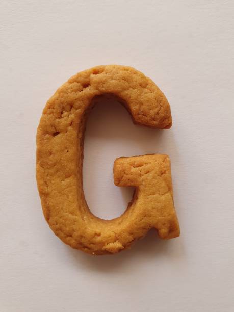istock baked cookie forming the letter G 1194546126