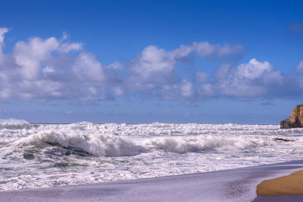 istock Turbulent Ocean Waves On Beach Off California Coast 1194546797