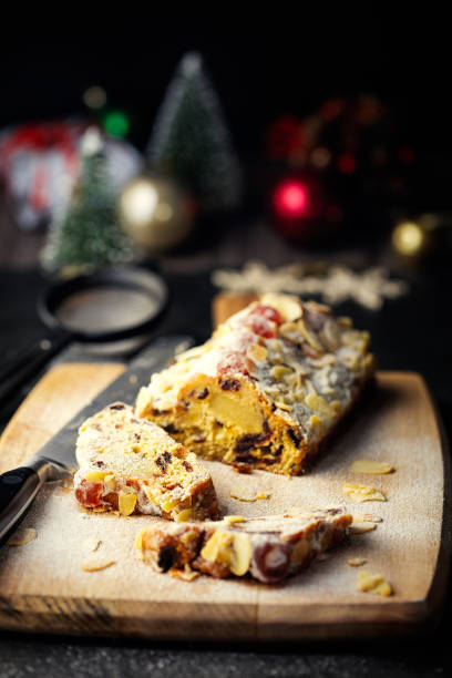 home baked christmas stollen loaf - dieting front view vertical lifestyles imagens e fotografias de stock