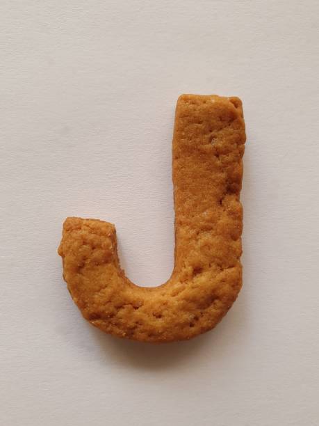 istock baked cookie forming the letter J 1194547239