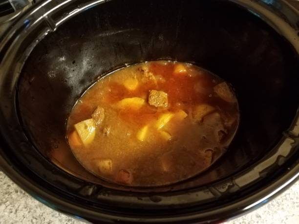 istock beef stew with potato in broth in cooking pot 1194548082
