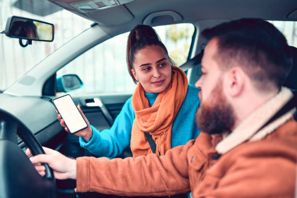 istock Female Showing Map Route To Male Driver 1194548778