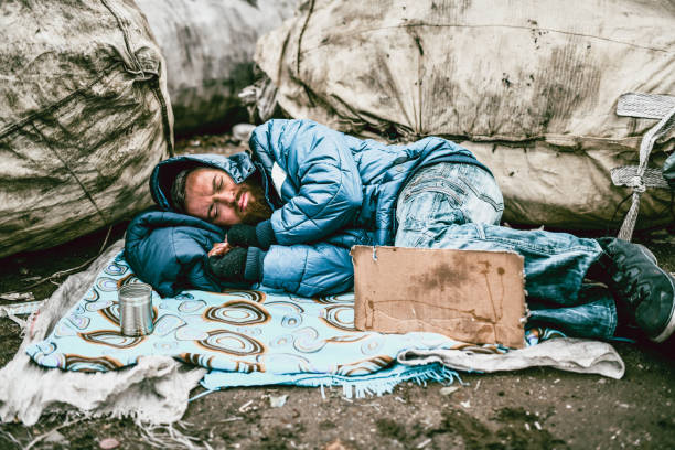 istock Homeless Male Sleeping On The Streets 1194548816