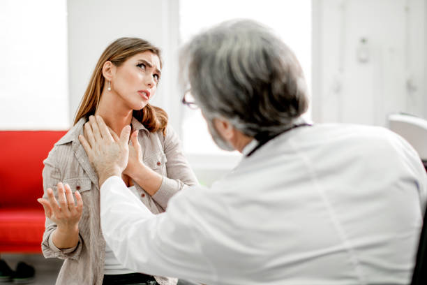 Young woman with sore throat Young woman have problem with sore throat or thyroid gland. lymph node photos stock pictures, royalty-free photos & images
