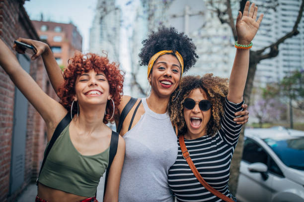 istock Three young women walking outdoors 1194551729