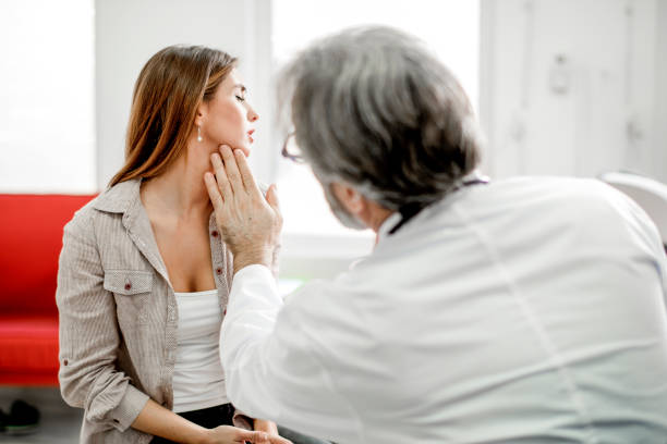 istock Young woman with sore throat 1194551744