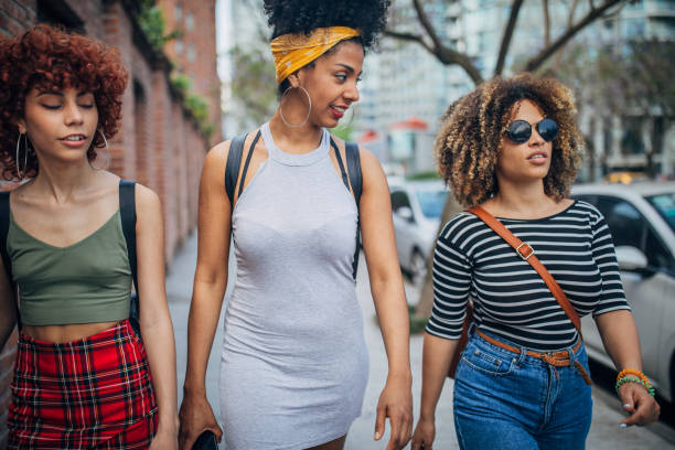 istock Three young women walking outdoors 1194552414