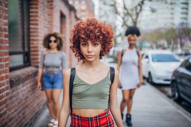 istock Three young women walking outdoors 1194552465