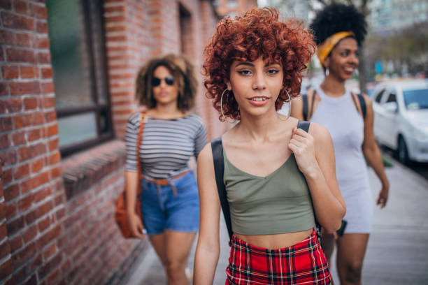 istock Three young women walking outdoors 1194552504