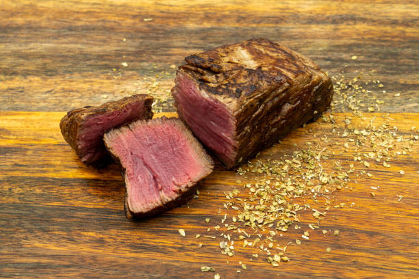 istock Cooked steak on wooden board 1194552651