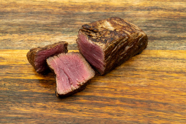 istock Cooked steak on wooden board 1194552664