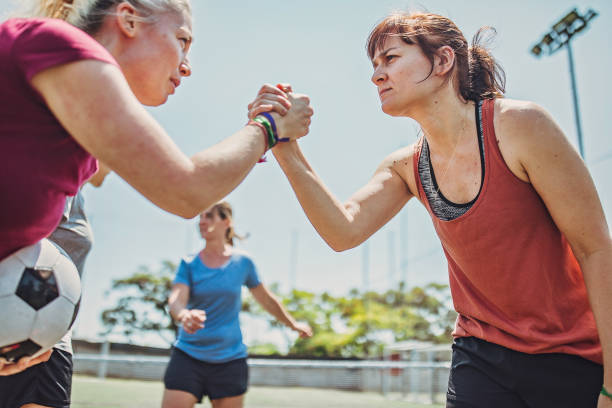 istock Women handshake on a soccer playing field 1194552943