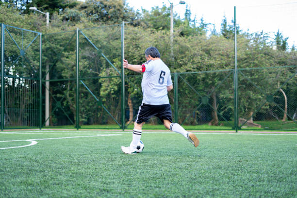 istock Older footballer ready to start playing a game 1194554118