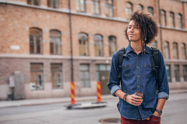 istock Hipster man drinking coffee in the city 1194554579