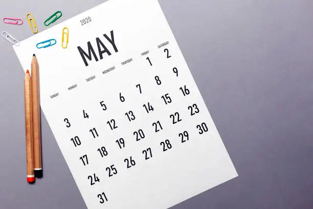 May 2020 simple calendar with office supplies and copy space