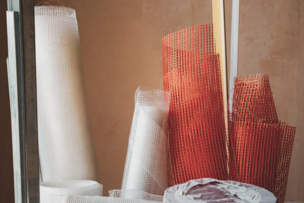 Building materials, fiberglass meshnets in a roll. Apartment renovation.