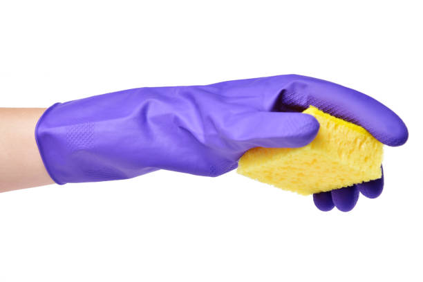 istock Hand with a sponge for washing dishes 1194557611