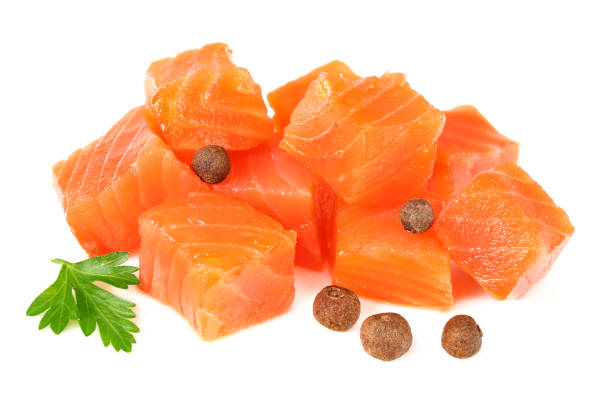 istock Red fish. Raw salmon fillet with parsley and peppercorns isolate on white background 1194557694