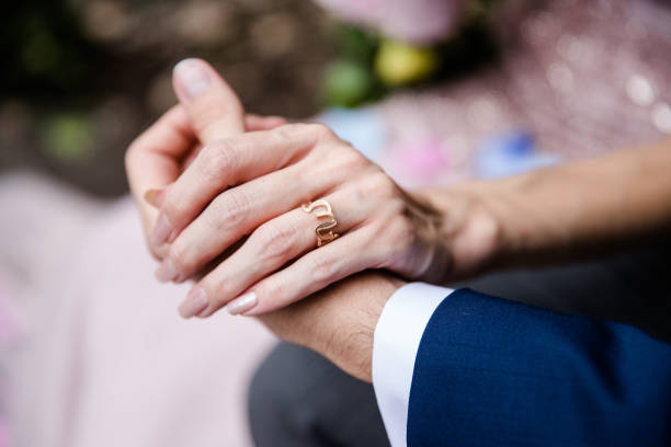 istock Bride and groom holding hands 1194559130