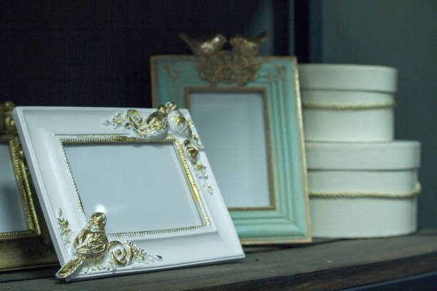 istock Close-up wooden shelf with vintage frames and hat boxes, selective focus 1194559397