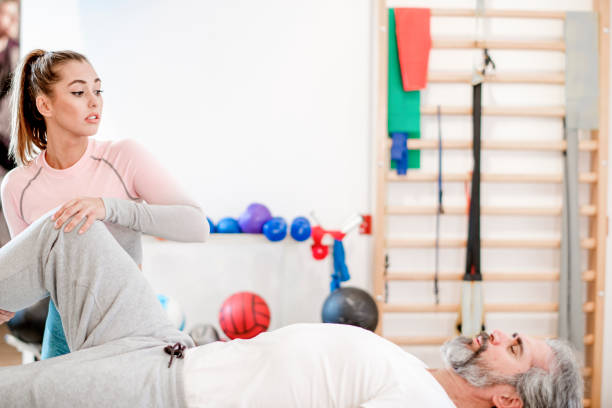 Stretching and Exercises for a Pain-free Sleep :Understanding the Benefits of Stretching Tips for Stretching Before Bed knee pain left knee left leg right knee legs extended opposite leg gentle stretch lean forward standing position leg stretches right foot physical therapist