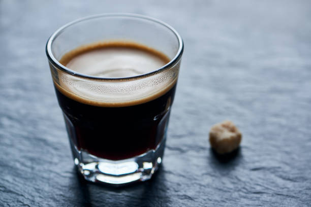 istock Coffee in glass cup on dark background. Close up. 1194565408