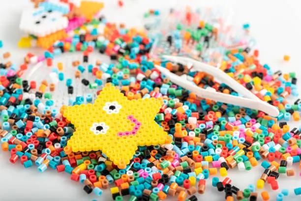 Toy in star form. Just made of fusible beads. Set, close up view.