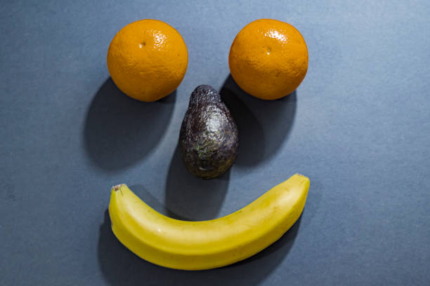 istock funny faces made with fruits and vegetables 1194567683