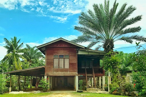 Traditional Woden Houses at a small village surrounded by trees in Malaysia , photo taken on 8th of December 2019 near Sungai Besar , Selangor