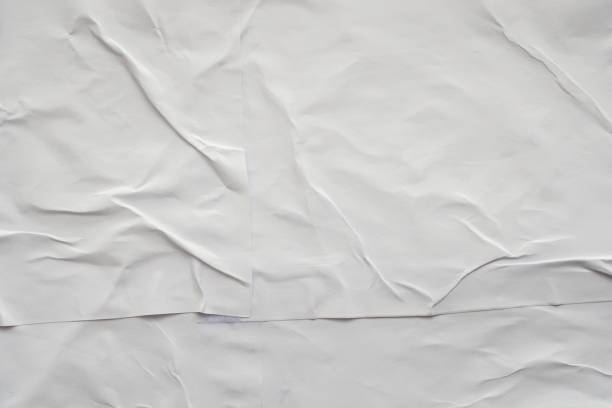 istock Blank white crumpled and creased paper poster texture background 1194573252